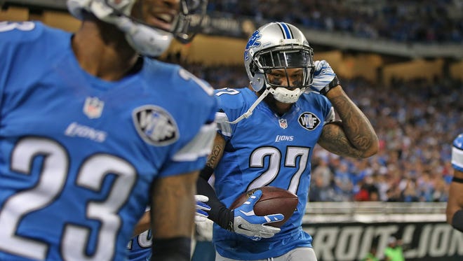 Glover Quin (27) of the Detroit Lions celebrates his interception of Drew Brees on Sunday, Oct. 19, 2014, in Detroit.