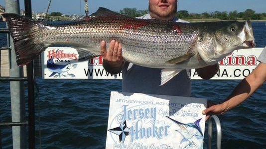 Capt. Rich Wilkowski, of the Jersey Hooker, with the 51-pound bass that won the annual Jersey Coast Shark Anglers Striped Bass contest on Saturday.