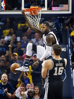 Grizzlies forward JaMychal Green (top) dunks over Spurs defender Pau Gasol during the second quarter of Game 4 of their NBA first-round playoff series last season.