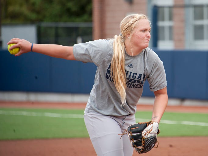 Michigan pitcher Megan Betsa throws during practice