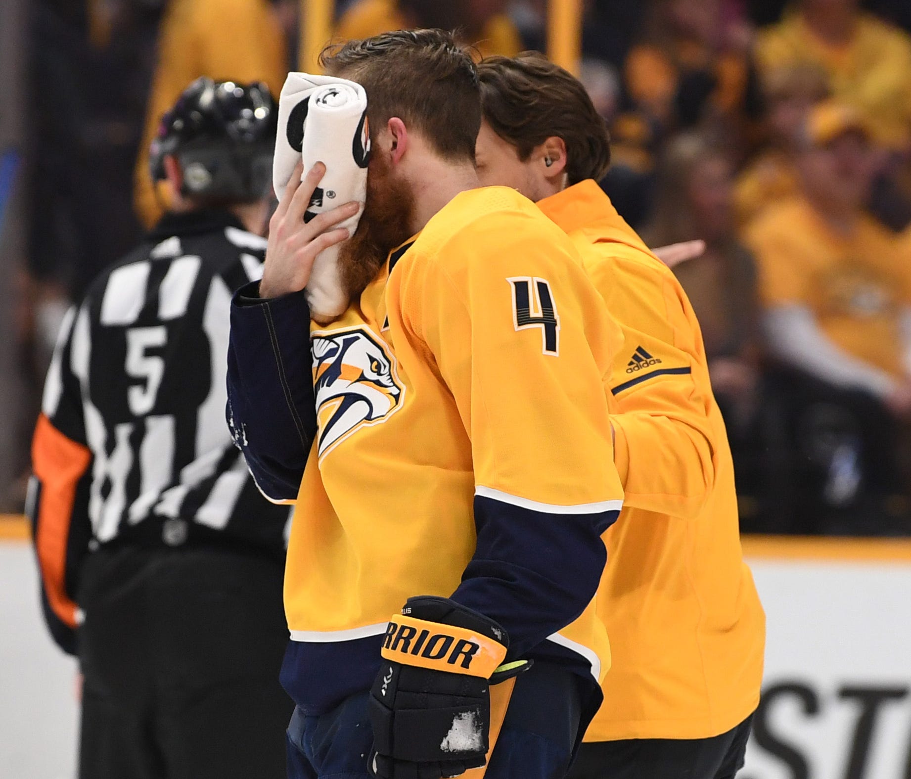 Nashville Predators defenseman Ryan Ellis is helped off the ice after taking a skate to the face during the third period against the Winnipeg Jets in Game 1 of their second-round series.