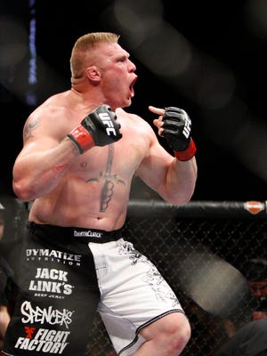 Brock Lesnar, who grew up in Webster, S.D., says he is leaving mixed martial arts to return to pro wrestling.