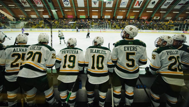 The Vermont bench watches the action during the men's hockey game between the UMass-Lowell River Hawks and the Vermont Catamounts at Gutterson Fieldhouse on Friday night January 19, 2018 in Burlington.