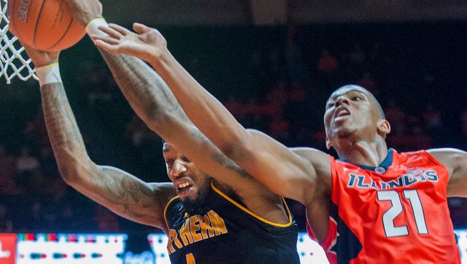 Illinois guard Malcolm Hill (21) goes for a rebound with Northern Kentucky forward Jeff Garrett (4) during the second half of an NCAA college basketball game in Champaign, Ill., on Sunday, Nov. 13, 2016. Illinois won 79-64.