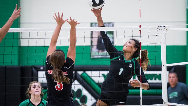 Yorktown's Kenzie Knuckles hits against Wapahani during their game at Yorktown High School Tuesday, Aug. 29, 2017. 