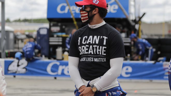 Bubba Wallace wears an "I Can't Breath, Black Lives Matter" shirt before a NASCAR Cup Series race at Atlanta Motor Speedway on Sunday, in Hampton, Ga.