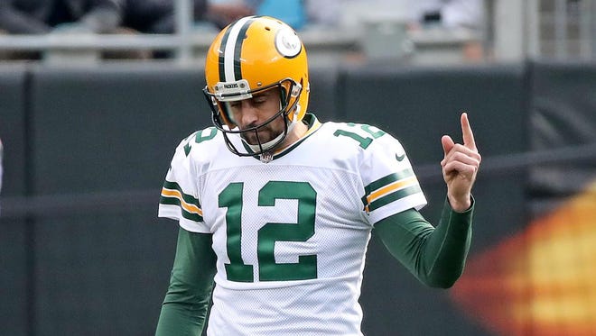 Green Bay Packers quarterback Aaron Rodgers (12) reacts after throwing an interception against the Carolina Panthers on Sunday, Dec. 17, 2017 at Bank of America Stadium in Charlotte, N.C.