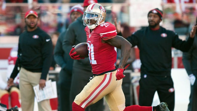 Dec 28, 2014; Santa Clara, CA, USA; San Francisco 49ers wide receiver Anquan Boldin (81) runs with the ball on his way to score a touchdown against the Arizona Cardinals during the first quarter at Levi's Stadium.