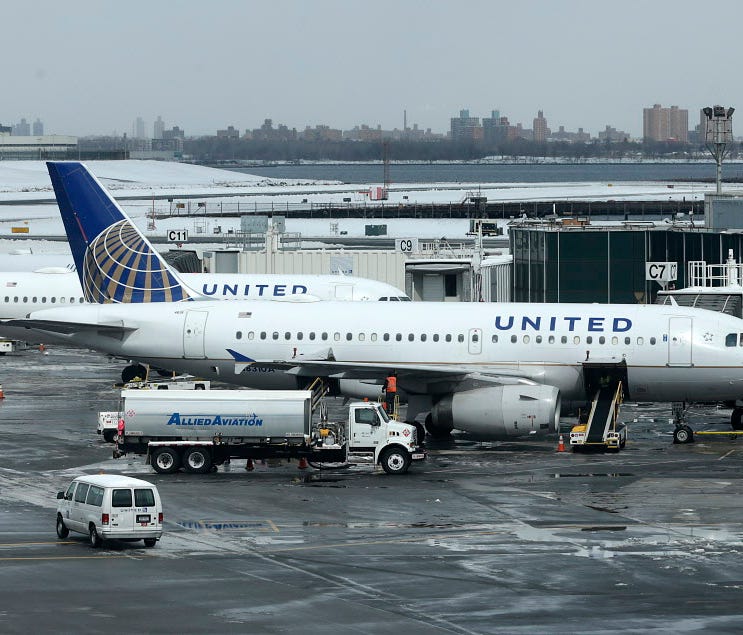 United Airlines jets sit on the tarmac at LaGuardia Airport in New York on March 15, 2017.