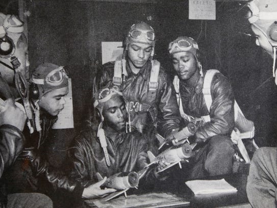 Tuskegee Airman Walter Manning, center, with several