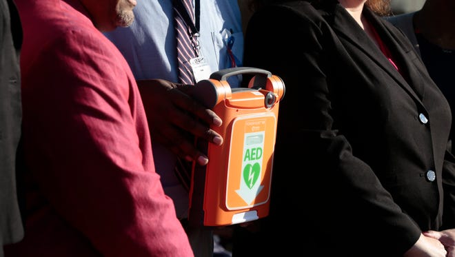An automated external defibrillator (AED) was donated at a ceremony Nov. 3, 2016. at the Holy Family School in Lafayette, where  student died of a heart failure last year.  