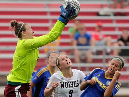 Winneconne goalie Sadie Kosciuk (1) claims the ball