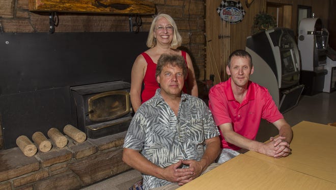 New owners Kathy and Rick Hatanpaa, left, and manager Shawn Larson still have a full plate of updates and new construction planned for the Cougar Canyon Lodge — including the construction of a stage for live music.