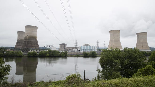 FILE - In this May 22, 2017 file photo shown is the Three Mile Island nuclear power plant in Middletown, Pa. With nuclear power plant owners seeking a rescue in Pennsylvania, a number of state lawmakers are signaling that they are willing to help, with conditions. Giving nuclear power plants what opponents call a bailout could mean a politically risky vote to hike electric bills. (AP Photo/Matt Rourke, File)