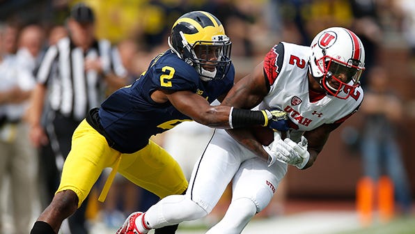 Utah's Kenneth Scott, pictured making a catch against Michigan last season, said, "Our team is always juiced no matter what."