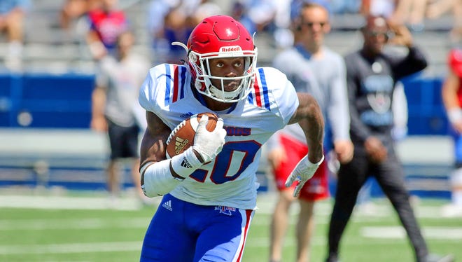 Louisiana Tech running back Jaqwis Dancy carries the ball in the Bulldogs' spring game. Dancy returned to the field following a several month battle with cancer.