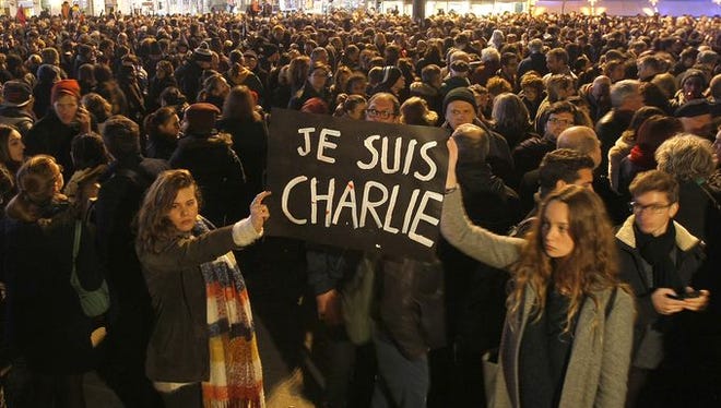 Thousands gather in Paris, among the many demonstrators worldwide expressing their solidarity with the French satirical weekly, Charlie Hebdo.
