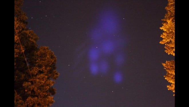 Purple vapor clouds can be seen from Hampton, Virginia, which were released early Thursday morning by NASA's Terrier-Improved Malemute sounding rocket. The rocket launched from Wallops Island following 10 earlier failed attempts.