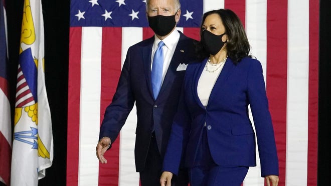 Democratic presidential candidate former Vice President Joe Biden and his running mate Sen. Kamala Harris, D-Calif., arrive to speak at a news conference.