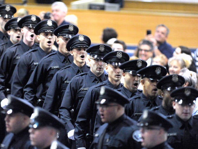Twenty five Detroit Police officers swear the Oath of Office