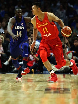 USA's Draymond Green defends against China's Yi Jianlian during the second half of a USA Basketball exhibition at Staples Center on Sunday.