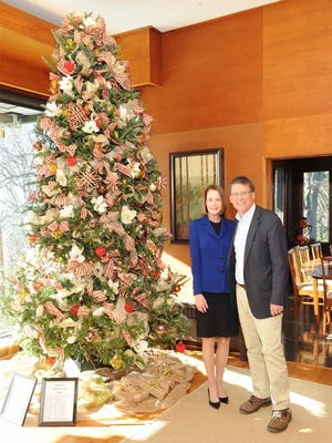 Then-first lady Ann McCrory and Gov. Pat McCrory stand by a Christmas tree at the Governor's Western Residence in 2016.