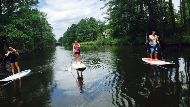 One of the last known pictures of Ryan Marshall, right, and his sunglasses as he paddleboards with Amanda Nelson, left, of Salisbury and Danielle Gagliano of Ocean City. Even with the loss of eyewear, the journey offered plenty of picturesque fun.