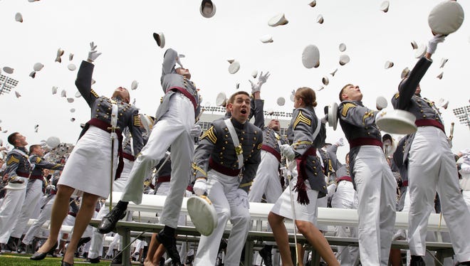 Graduates of the U.S. Military Academy in West Point celebrate at the end of the commencement in 2010.