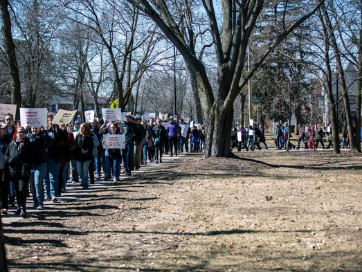 Protesters march to Old Main for a demonstration and
