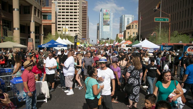 Thousands of people show up in the streets at the Cinco de Mayo Phoenix Festival on May 7, 2017 in downtown Phoenix, Ariz. 