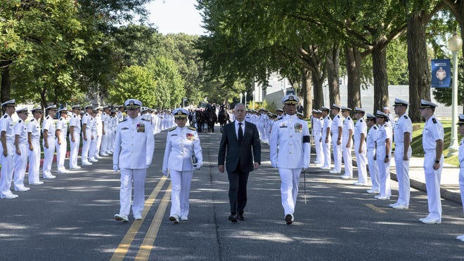 In this image proved by the U.S. Navy, Defense Secretary Jim Mattis, second from right, walks ahead of he horse-drawn caisson bearing the body of Sen. John McCain, R-Ariz., through the grounds of the United Sates Naval Academy toward the cemetery after a service in the Chapel Sunday, Sept. 2, 2018, in Annapolis, Md.(Mass Communication Specialist 2nd Class Nathan Burke/U.S. Navy via AP)