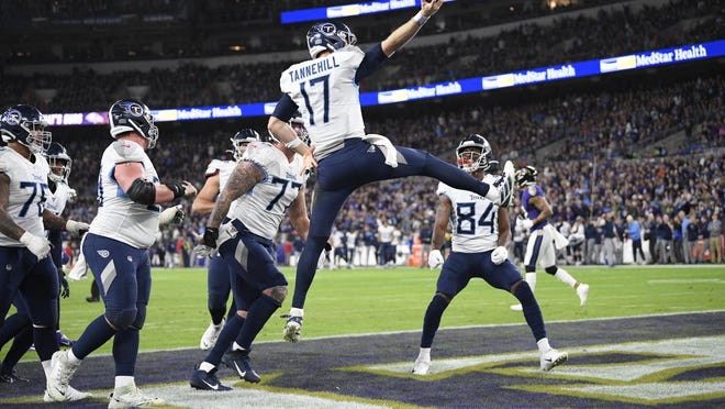 Tennessee Titans quarterback Ryan Tannehill (17) celebrates his touchdown during the second half of an NFL divisional playoff against the Baltimore Ravens.
