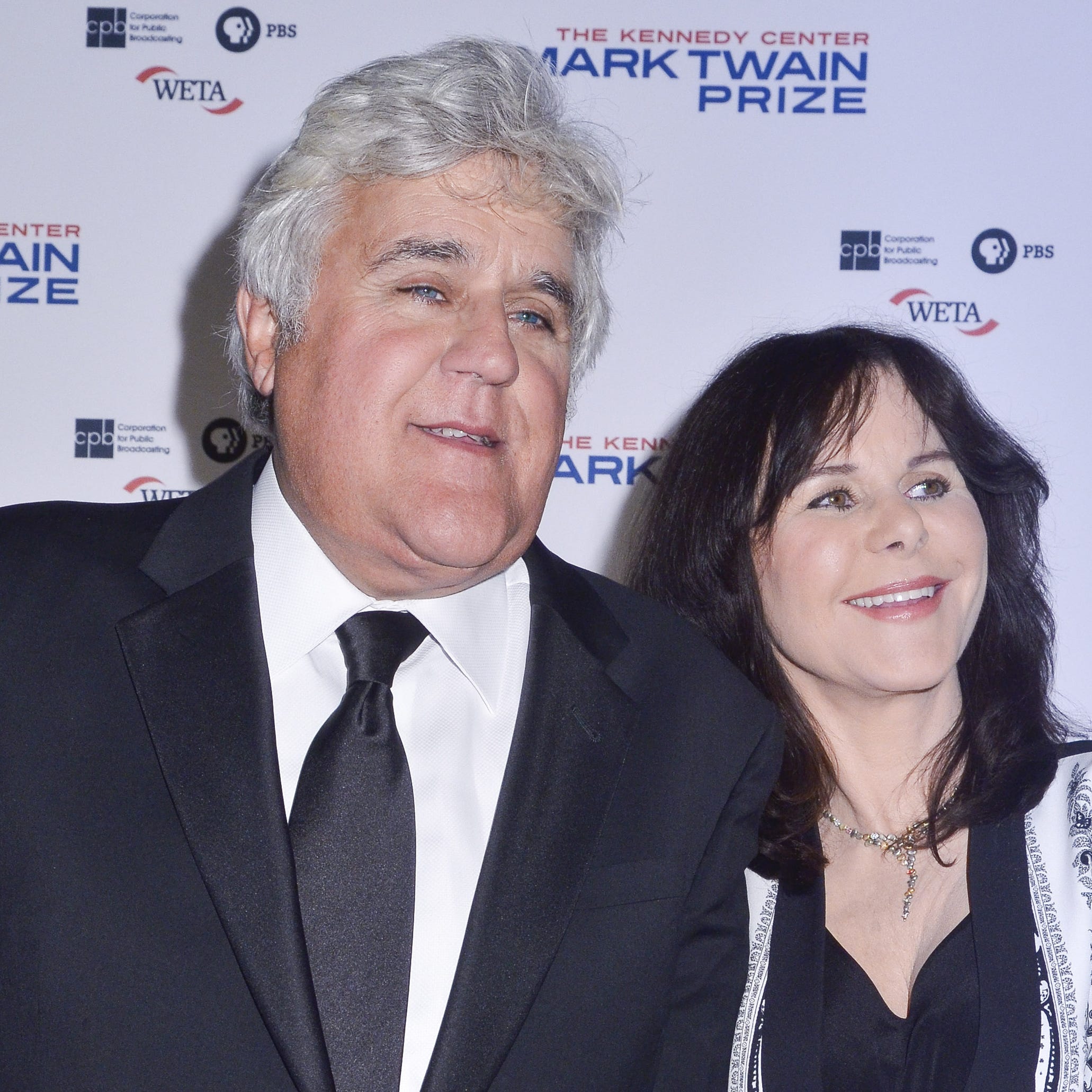 Jay Leno and Mavis Leno walks the red carpet during the 2014 Kennedy Center's Mark Twain Prize For American Humor at The John F. Kennedy Center for the Performing Arts on October 19, 2014 in Washington, D,C.