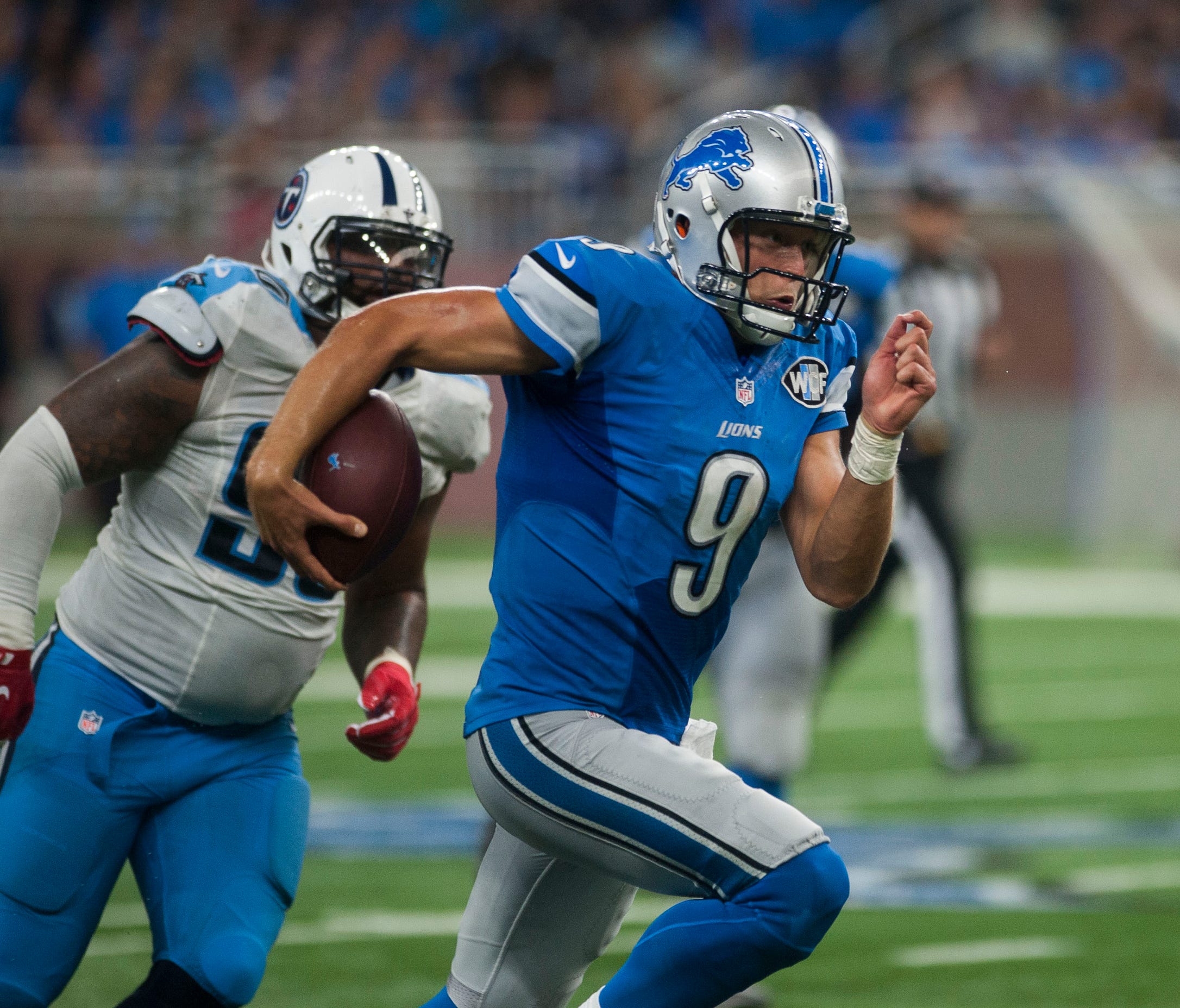 Lions quarterback Matthew Stafford rushes against the Titans at Ford Field on Sept. 18, 2016.