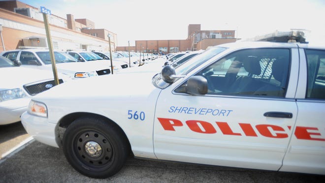 Police cruisers are lined up outside Shreveport Police Department moments before a shift change.