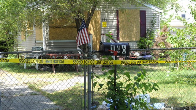 Police tape is seen, Friday July 22, 2016, around a home located at 146 W. Milton in Hazel Park following a corpse being removed from the home. (Steve Perez/ The Detroit News)