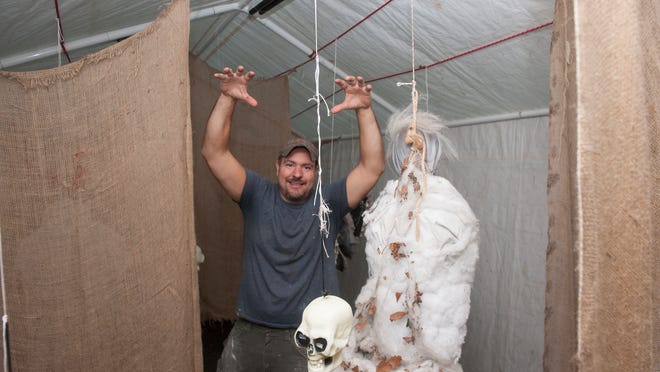 
Jon Martin poses as he works in a haunted house room at his home in Pitman. Every fall  Martin turns his yard into a haunted house for charity. He’s been doing it for 14 years to benefit South Jersey Community Impact. 
