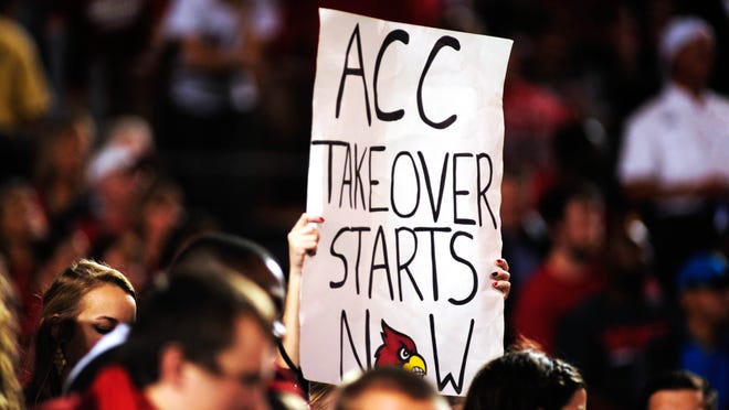 
A U of L fan with a sign at the Russell Athletic Bowl was already looking foward to the Cardinals joining the ACC.
