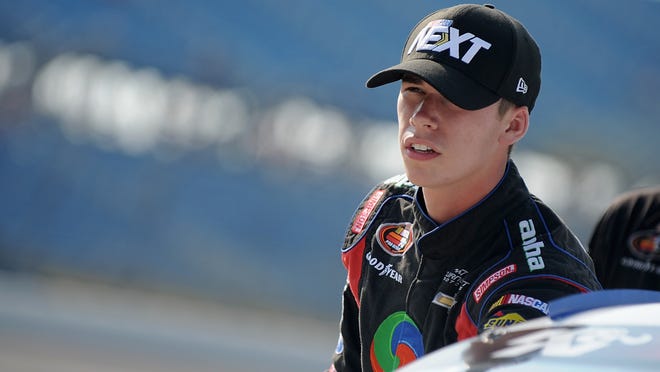 Ben Rhodes, pictured Aug. 1, stands on the grid during qualifying for a K&N Pro Series East event at the Iowa Speedway.