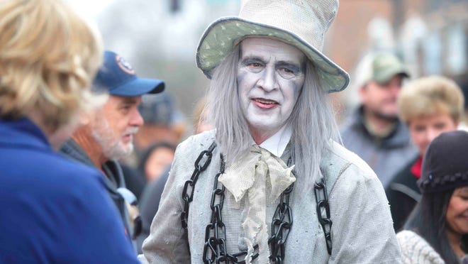 Character Jacob Marley walks the street at Dickens of a Christmas in downtown Franklin, Tenn. December 13, 2014.