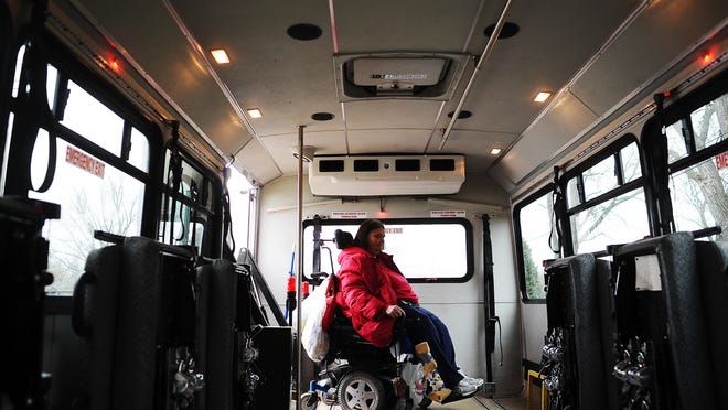 
Charlene Harbert gets on the Sioux Area Metro Paratransit Bus at her home last week. Because of changes to bus routes and the evening service, Harbert can no longer get a ride after 7 p.m. 
