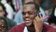 Cleveland Cavaliers' LeBron James talks on the phone