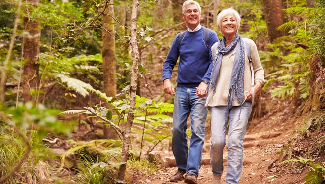 Senior couple walking together in a forest
