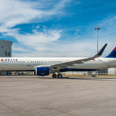 A Delta Air Lines plane parked on the tarmac.