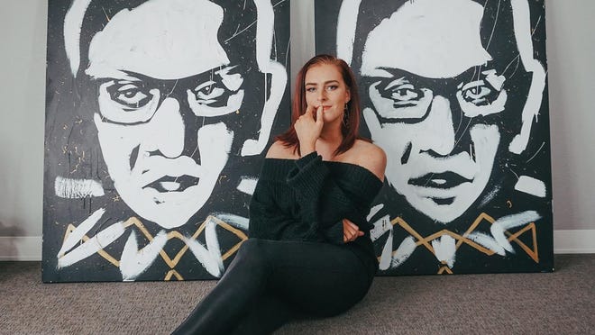 Miss Kansas Annika Wooton posed with two portraits she speed painted portraying Ruth Bader Ginsburg. The one on the right was created during a practice run and the one on the left during competition at last December's Miss America pageant.