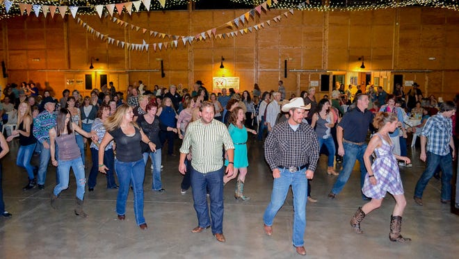 Ain't no horsin' around at the annual Oregon Garden Barn Dance & Pig Roast.