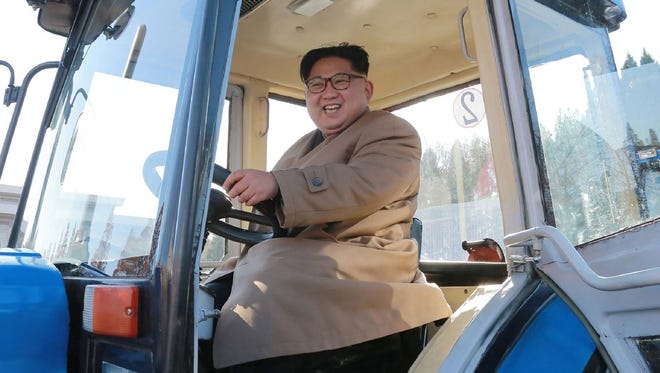 This undated picture released from North Korea's official Korean Central News Agency on Nov. 15 shows North Korean leader Kim Jong Un inspecting the Kumsong Tractor Factory in Nampo City, North Korea.