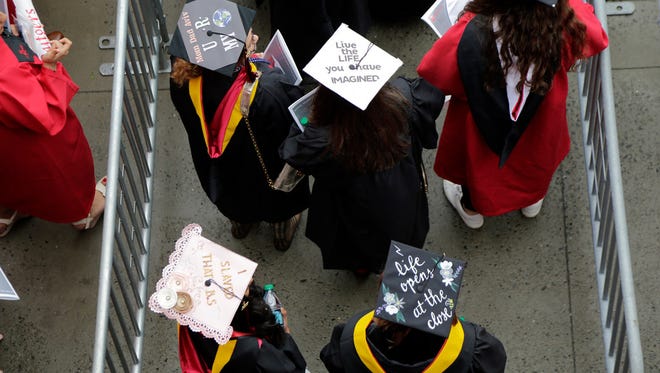 Rutgers University students walk into their graduation ceremony,  Piscataway Township, N.J., May 13, 2018.