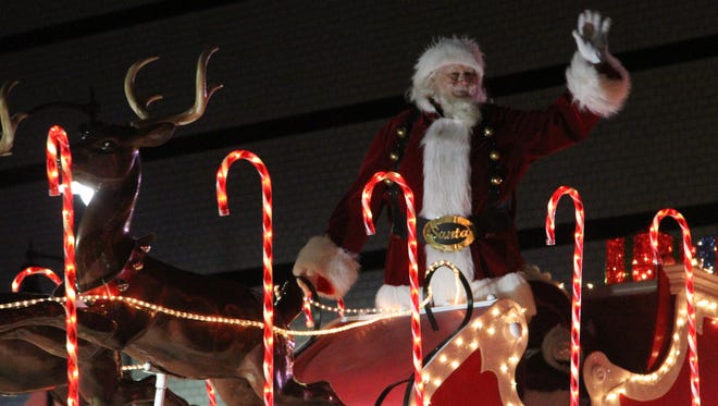 The figure of Santa Claus waves to the crowd during the Greater Lafayette Christmas Parade on Dec. 3, 2016, in Lafayette.