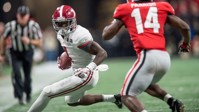 Alabama wide receiver Jerry Jeudy (4) carries against Georgia in second half action of the College Football Playoff National Championship Game in the Mercedes Benz Stadium in Atlanta, Ga., on Monday January 8, 2018. (Mickey Welsh / Montgomery Advertiser)